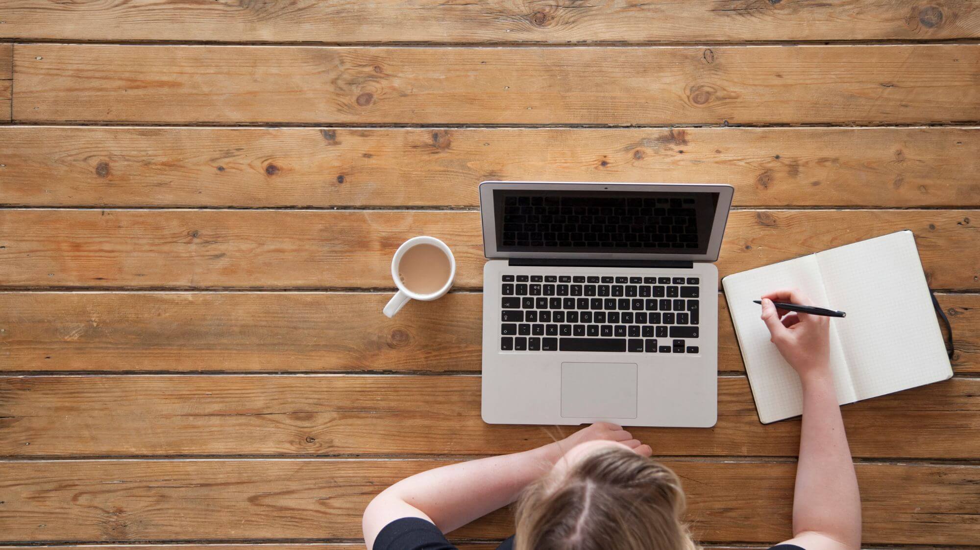 A person sitting in front of a laptop